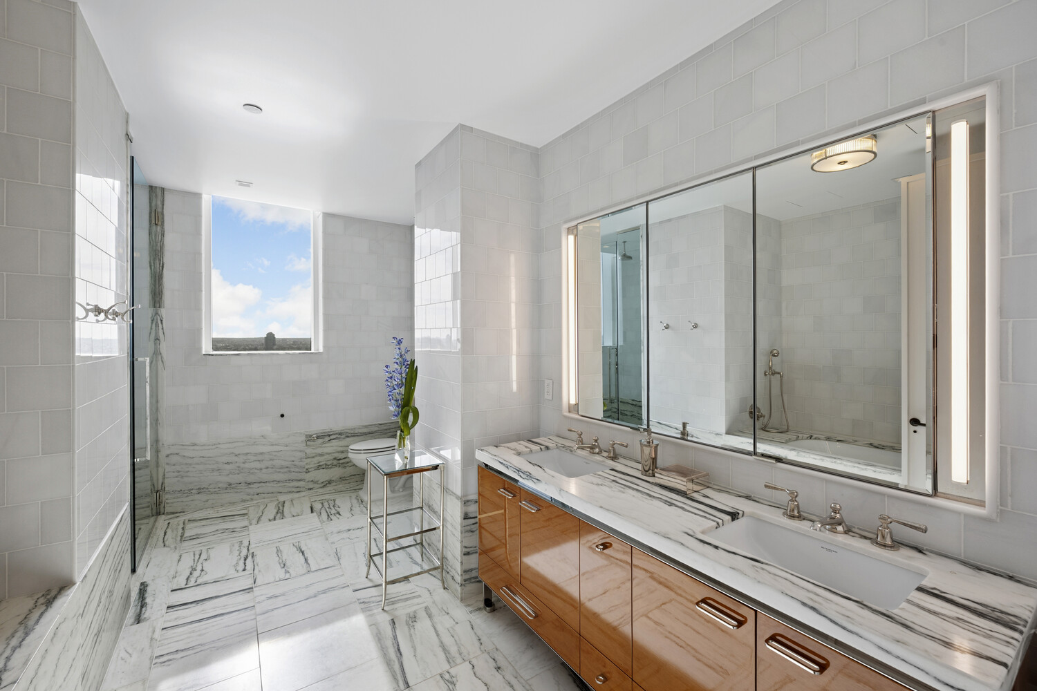 45 East 22nd Street, Unit 37B Manhattan, NY 10010 - Photo 11 of 13 a bathroom with a granite countertop sink mirror and double