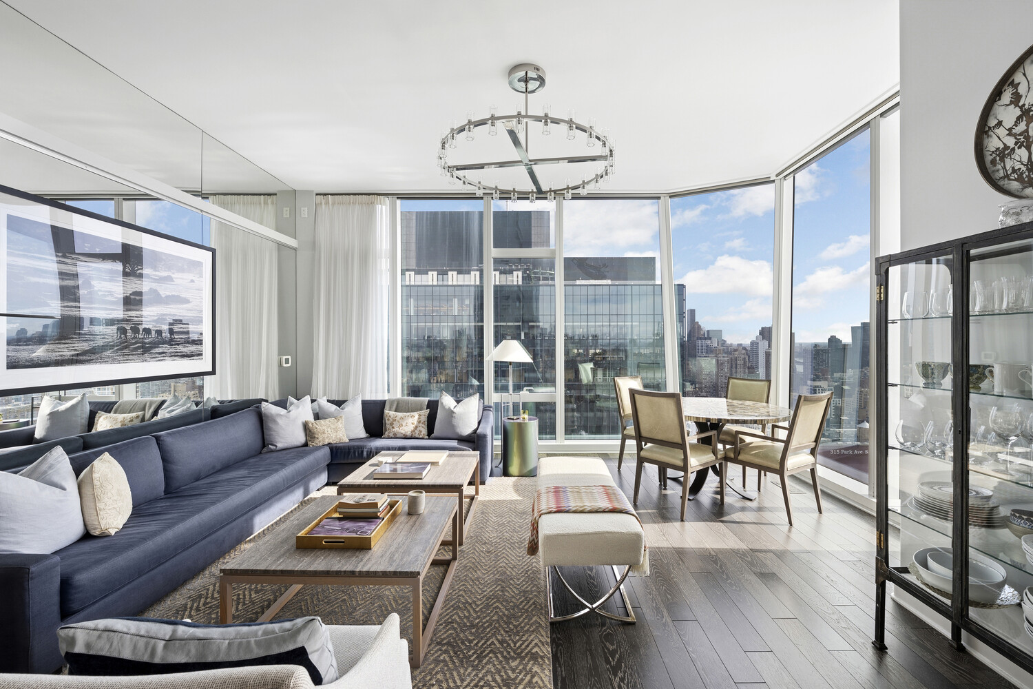 45 East 22nd Street, Unit 37B Manhattan, NY 10010 - Photo 2 of 13 a living room with furniture a ceiling fan and a large window