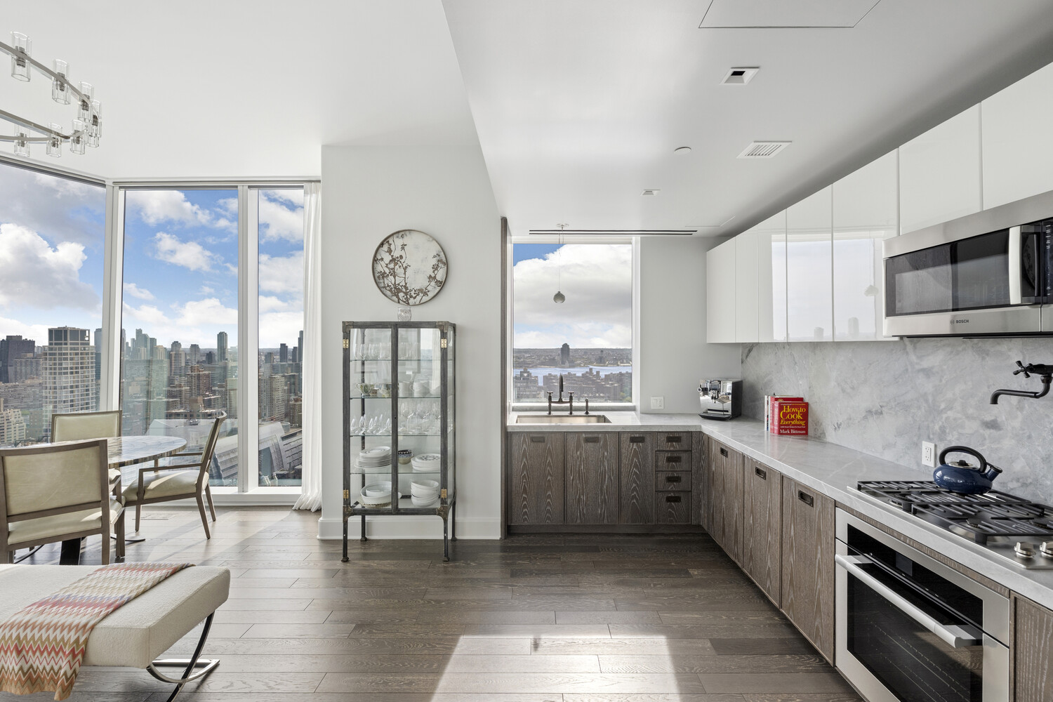 45 East 22nd Street, Unit 37B Manhattan, NY 10010 - Photo 5 of 13 a open kitchen with stainless steel appliances granite countertop a stove and cabinets