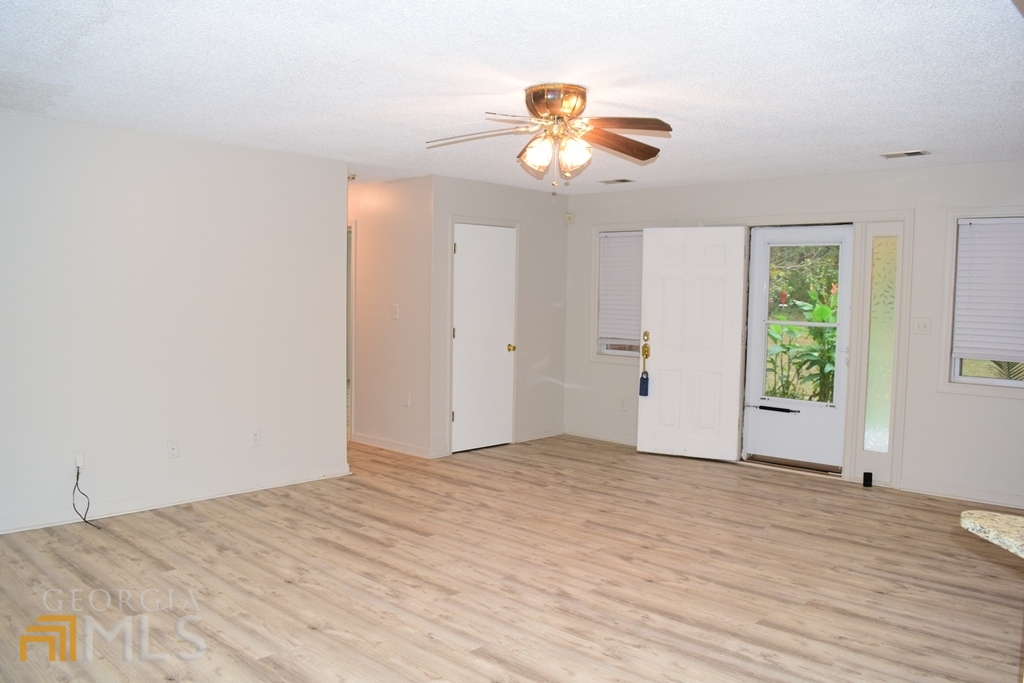 672 Andrew Bailey Road Sharpsburg, GA 30277 - Photo 12 of 34 a view of empty room with wooden floor