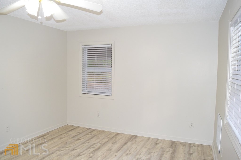 672 Andrew Bailey Road Sharpsburg, GA 30277 - Photo 14 of 34 an empty room with a window