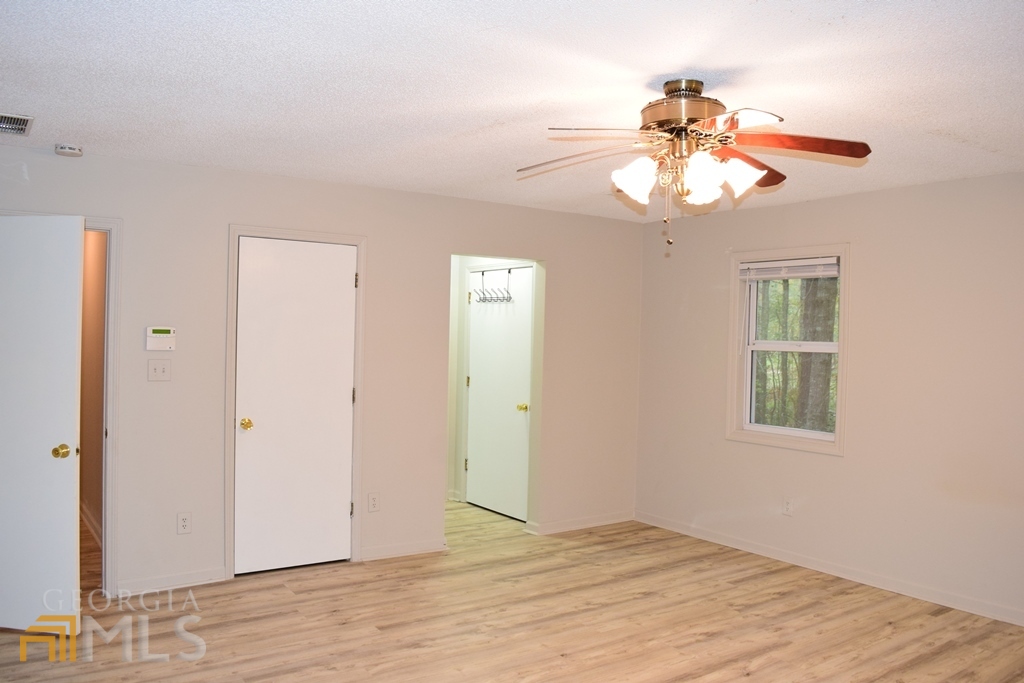 672 Andrew Bailey Road Sharpsburg, GA 30277 - Photo 25 of 34 a view of an empty room with a window