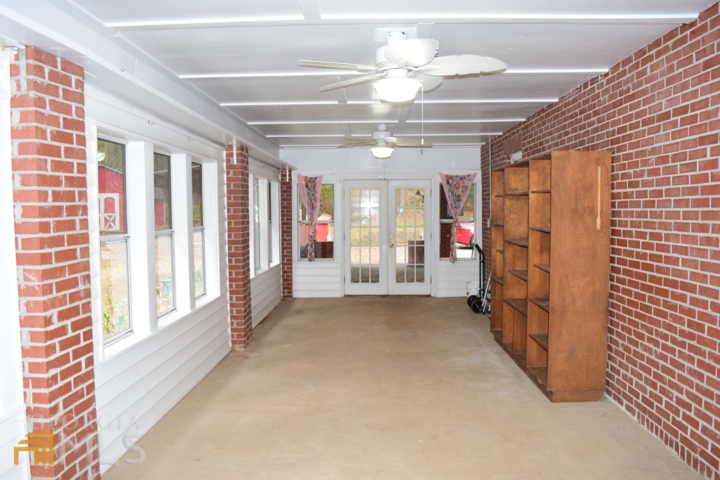 672 Andrew Bailey Road Sharpsburg, GA 30277 - Photo 29 of 34 a view of a livingroom with a ceiling fan and window