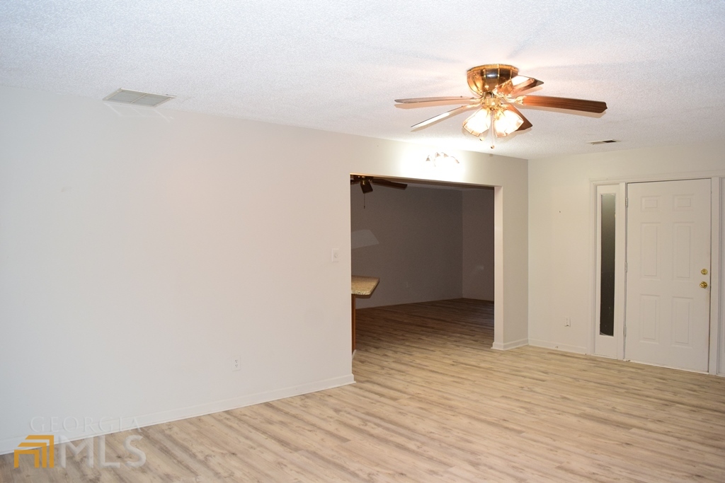 672 Andrew Bailey Road Sharpsburg, GA 30277 - Photo 4 of 34 wooden floor in an empty room