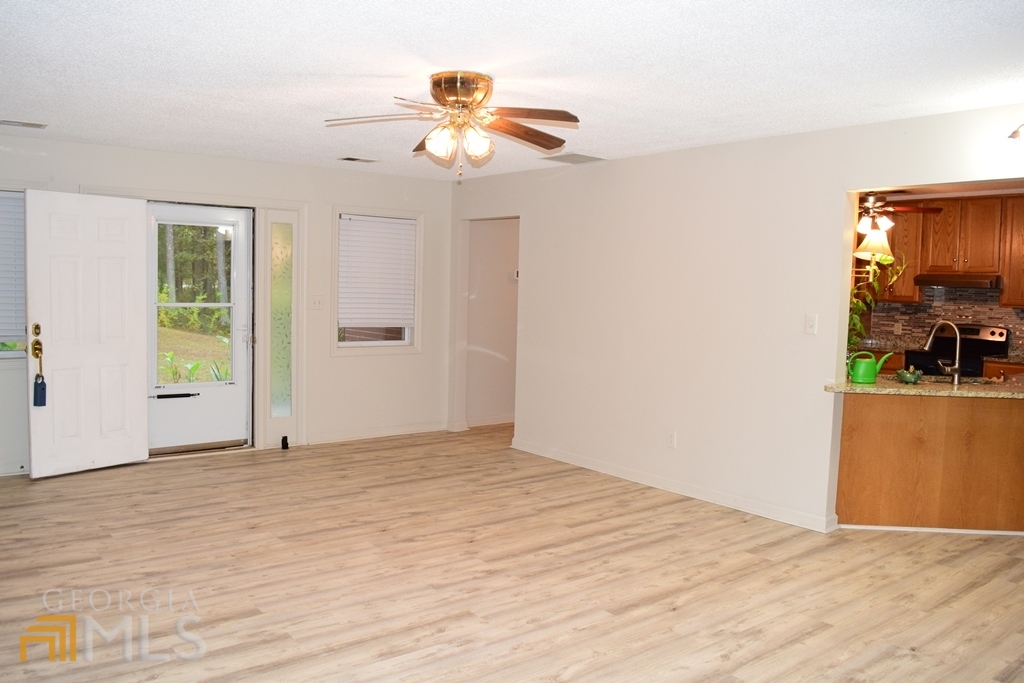 672 Andrew Bailey Road Sharpsburg, GA 30277 - Photo 6 of 34 a view of empty room with wooden floor