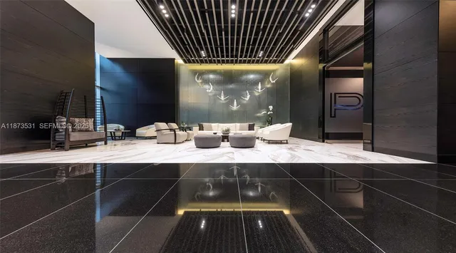 a bedroom with bed and a large mirror