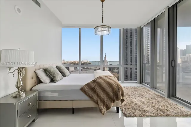 a view of a living room and floor to ceiling window