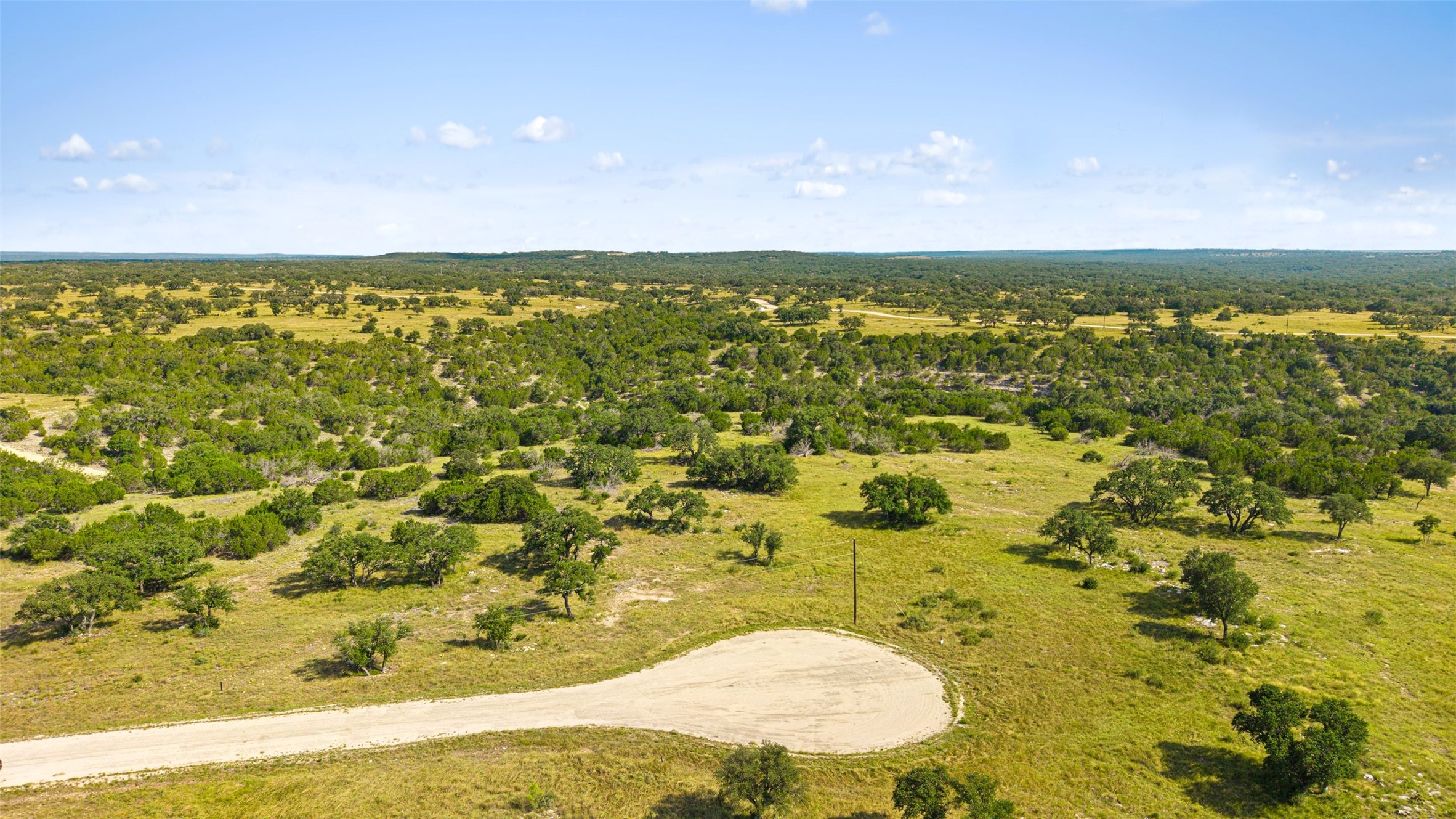 2915 Spring Crossing Junction, TX 76849 - Photo 3 of 31 Vast natural acreage with scattered mature trees offers a private, serene setting.