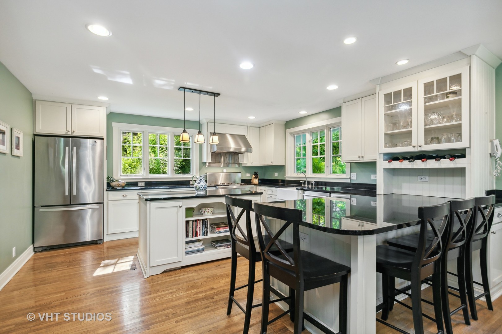 804 Murray Road Tower Lakes, IL 60010 - Photo 12 of 44 a kitchen with a table chairs refrigerator microwave and cabinets