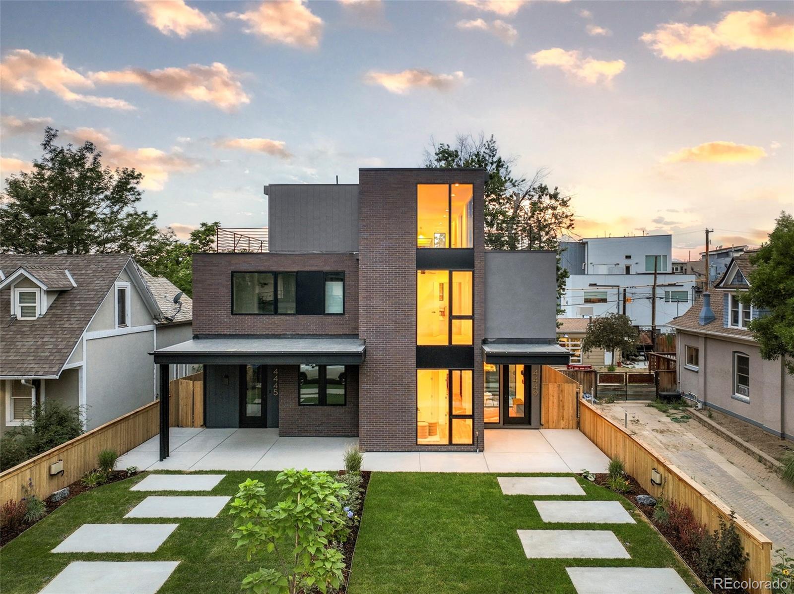 a front view of a house with a yard table and chairs