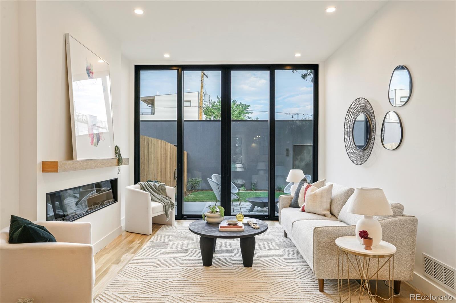 4449 Stuart Street Denver, CO 80212 - Photo 12 of 44 a living room with furniture and a large window