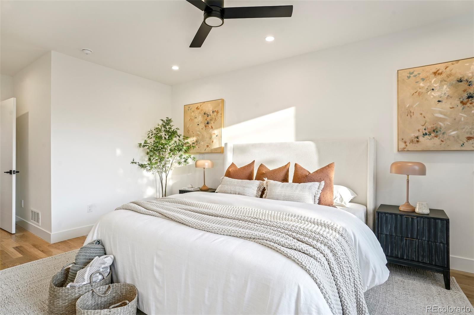 4449 Stuart Street Denver, CO 80212 - Photo 20 of 44 a bedroom with a bed and a table