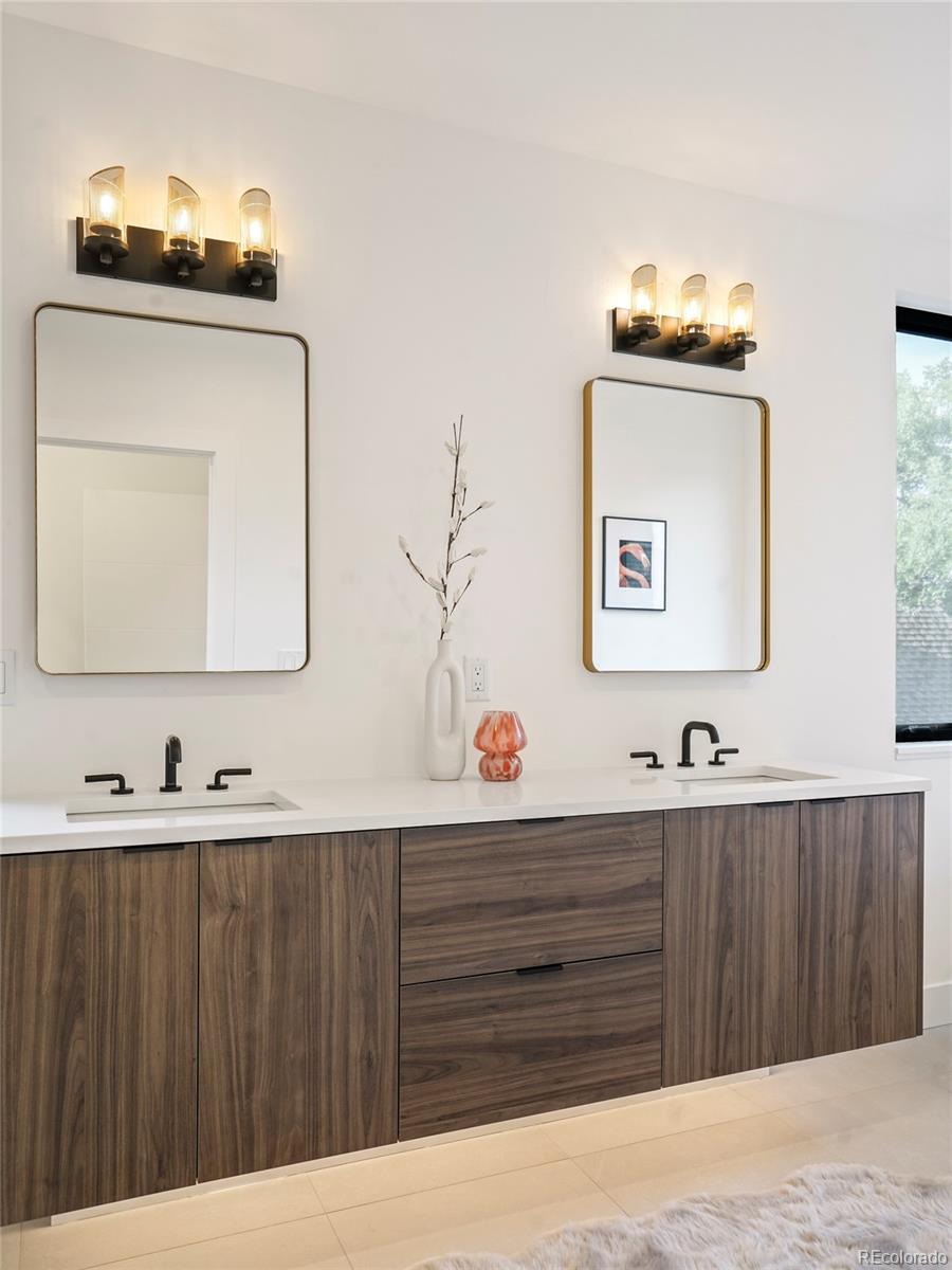 4449 Stuart Street Denver, CO 80212 - Photo 22 of 44 a bathroom with a sink vanity and a mirror