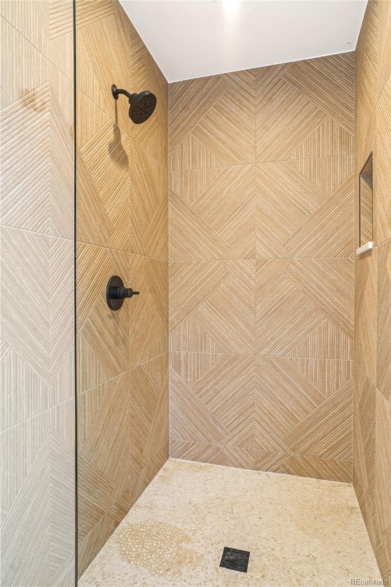 4449 Stuart Street Denver, CO 80212 - Photo 25 of 44 a bathroom with a shower