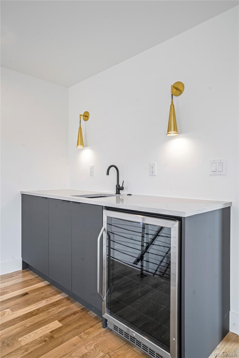 4449 Stuart Street Denver, CO 80212 - Photo 29 of 44 a bathroom with a sink and mirror