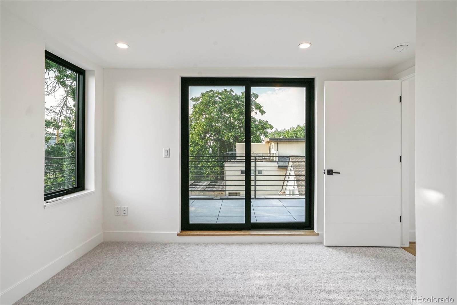 4449 Stuart Street Denver, CO 80212 - Photo 31 of 44 a view of an empty room with a window
