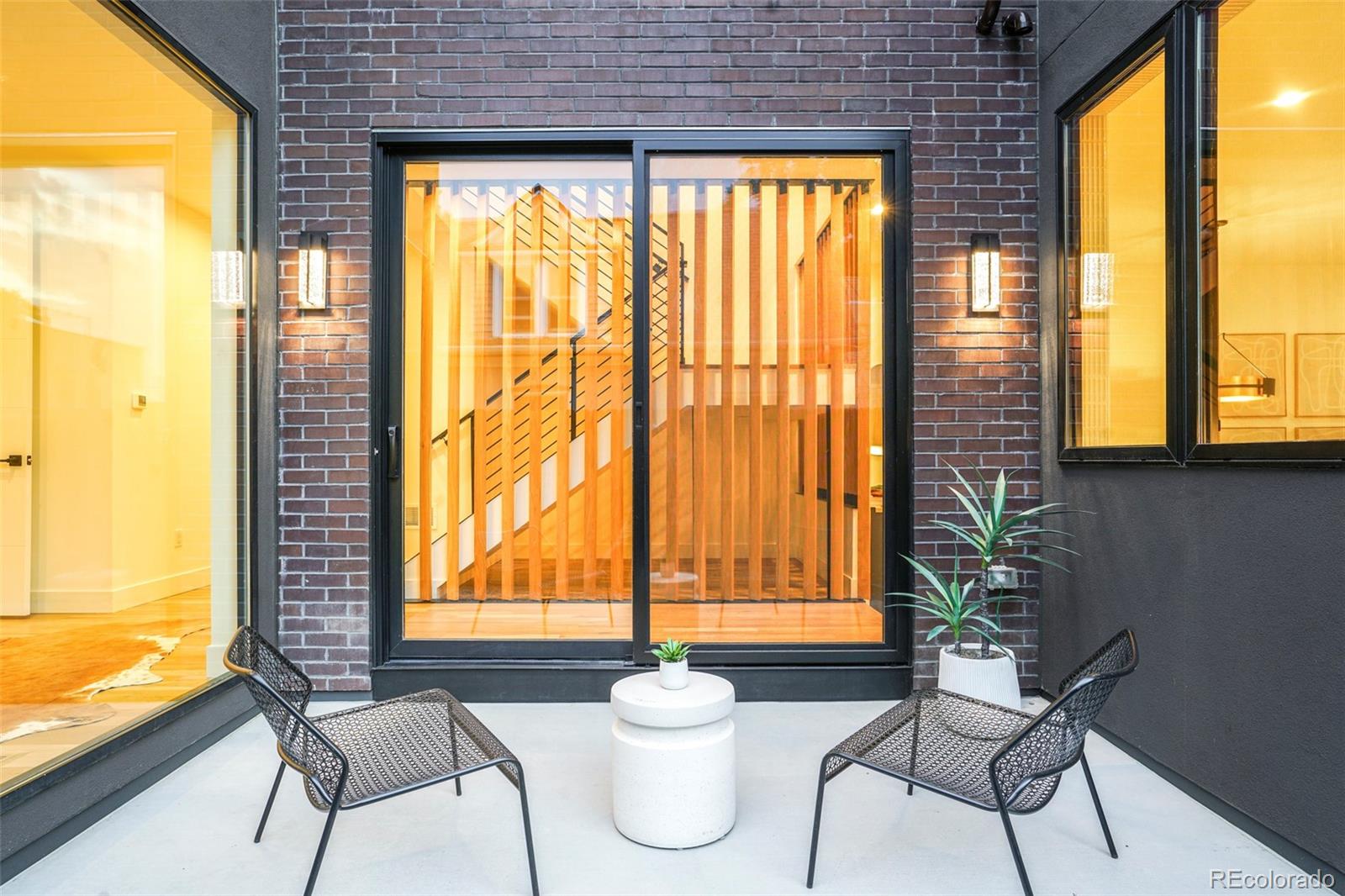4449 Stuart Street Denver, CO 80212 - Photo 42 of 44 a porch with a table and chair