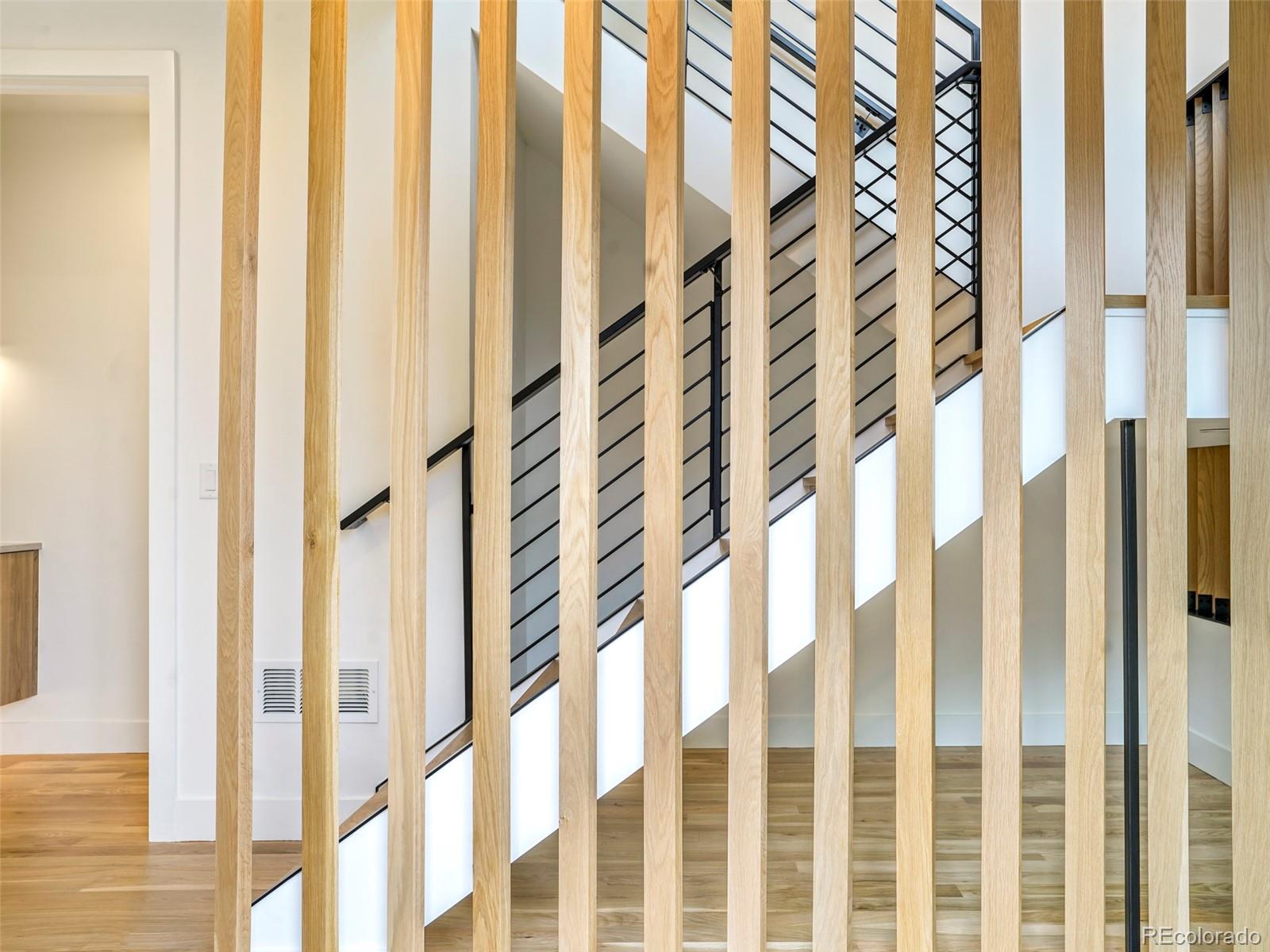 4449 Stuart Street Denver, CO 80212 - Photo 5 of 44 a view of a bathroom with a shower curtain