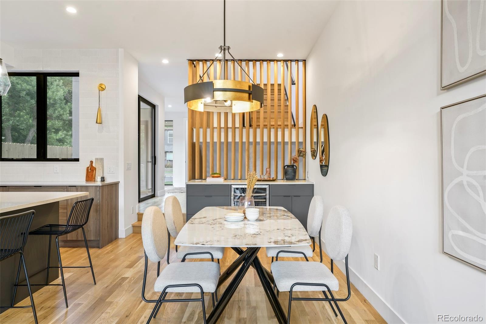 4449 Stuart Street Denver, CO 80212 - Photo 7 of 44 a view of a dining room with furniture window and wooden floor