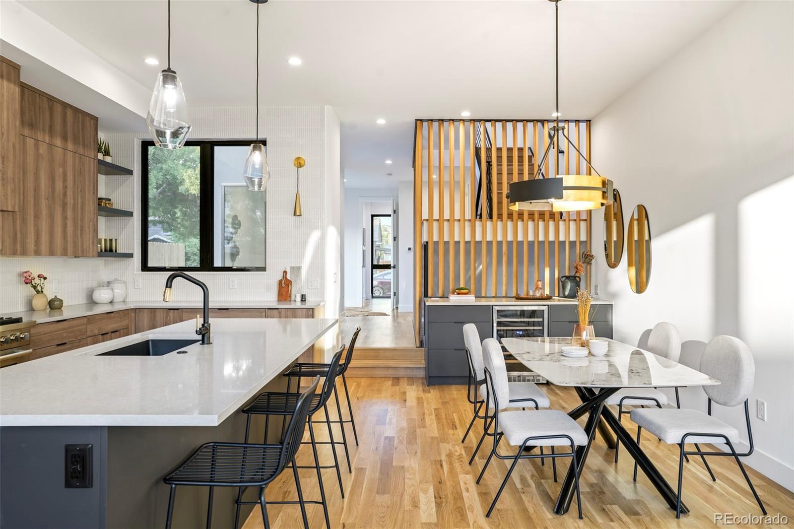 4449 Stuart Street Denver, CO 80212 - Photo 8 of 44 a kitchen with a table chairs stove and kitchen view
