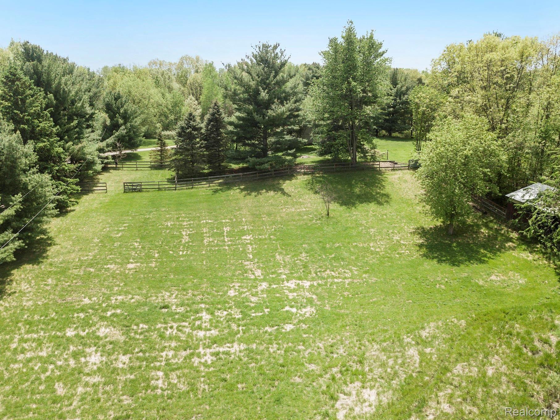 800 Sleaford Road Howell, MI 48843 - Photo 25 of 29 barn, open pasture, and horse corral