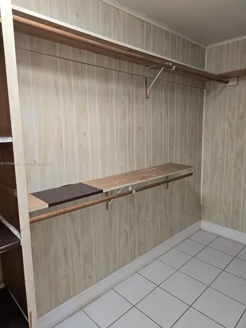 a view of a porch with furniture and a yard