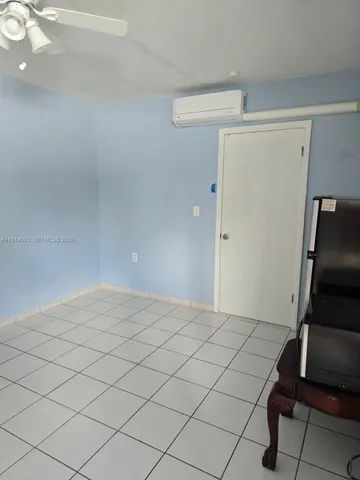 an aerial view of residential houses and car parked