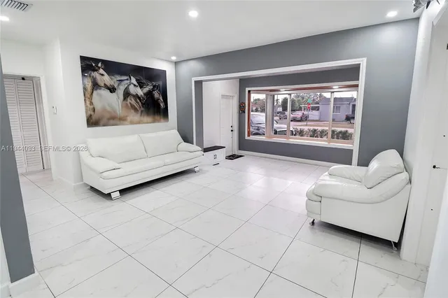 a kitchen with stainless steel appliances granite countertop a refrigerator stove and microwave