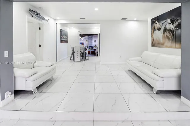 a kitchen with stainless steel appliances granite countertop a stove microwave and sink