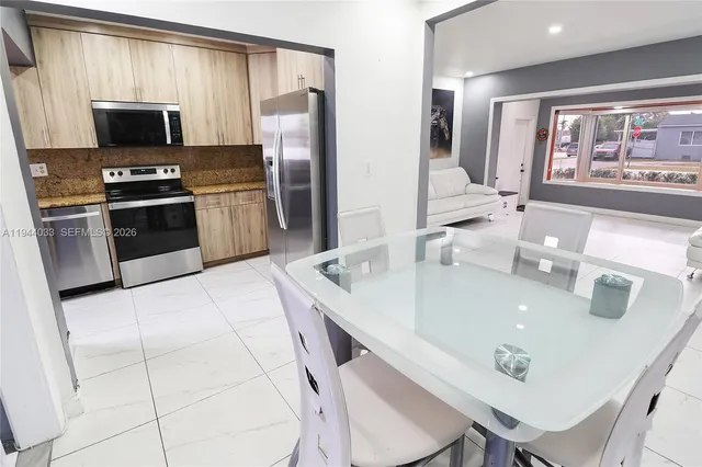 a living room with lots of furniture and a window