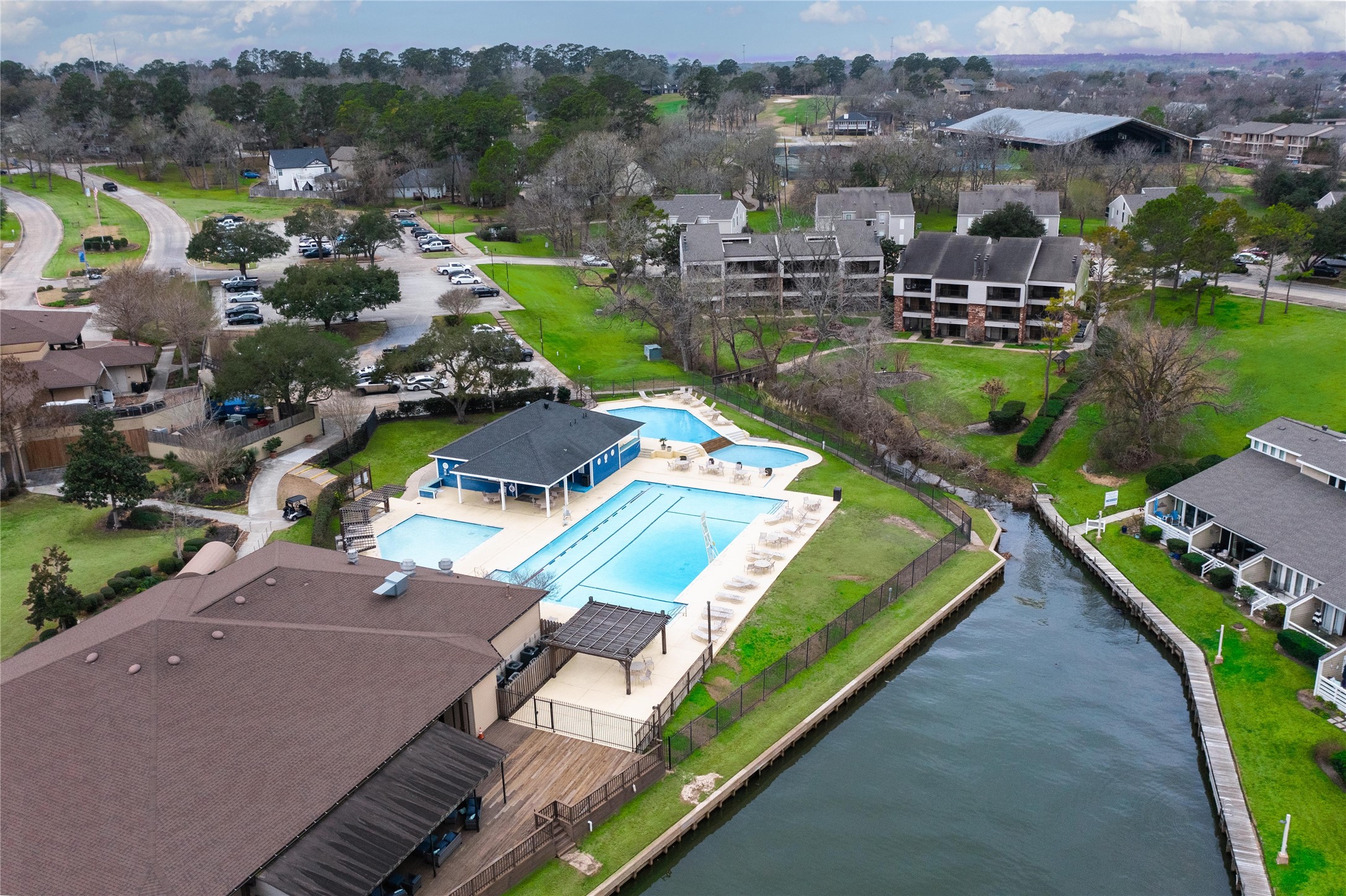 1000 April Sound Boulevard Conroe, TX 77356 - Photo 5 of 46 an aerial view of a house with a garden and lake view