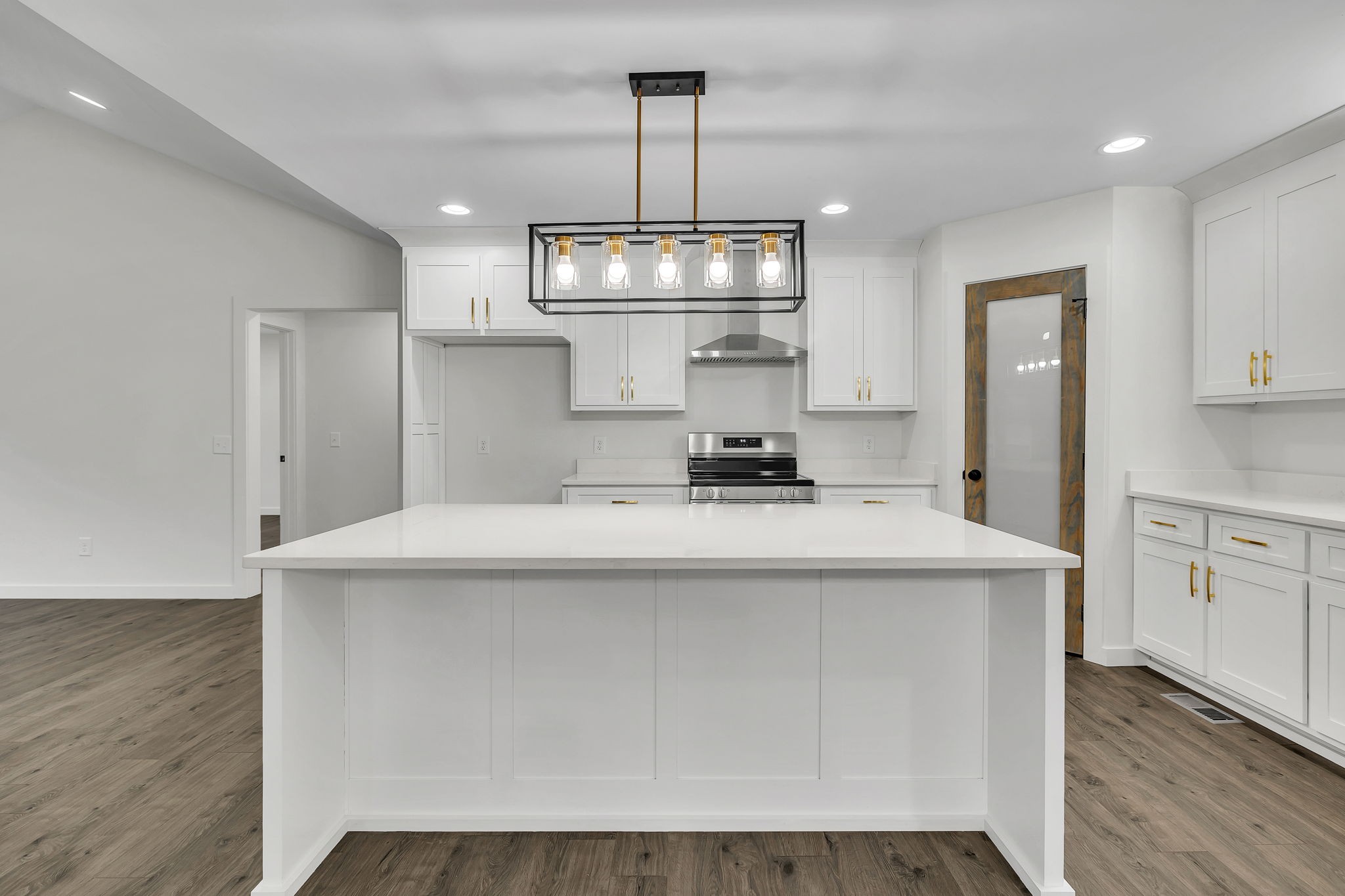 500 Difficult Road Pleasant Shade, TN 37145 - Photo 12 of 40 a kitchen with kitchen island stainless steel appliances a stove refrigerator and cabinets