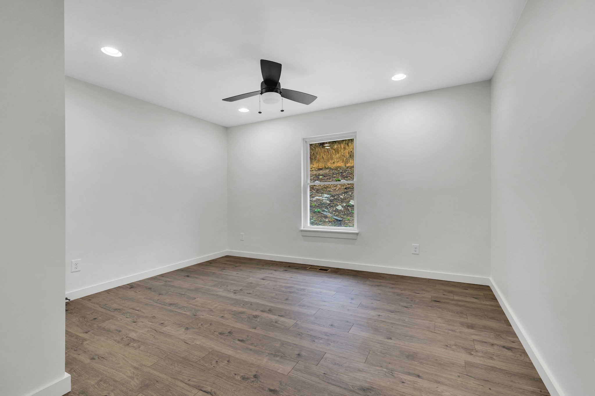 500 Difficult Road Pleasant Shade, TN 37145 - Photo 27 of 40 an empty room with a window and a ceiling fan