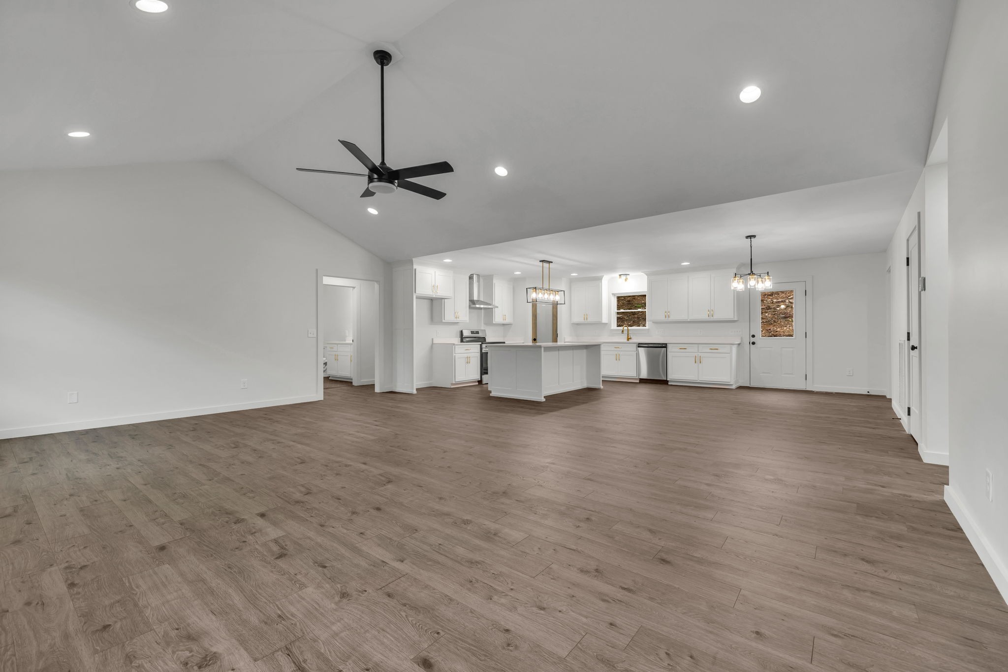 500 Difficult Road Pleasant Shade, TN 37145 - Photo 3 of 40 a view of empty room with wooden floor and ceiling fan