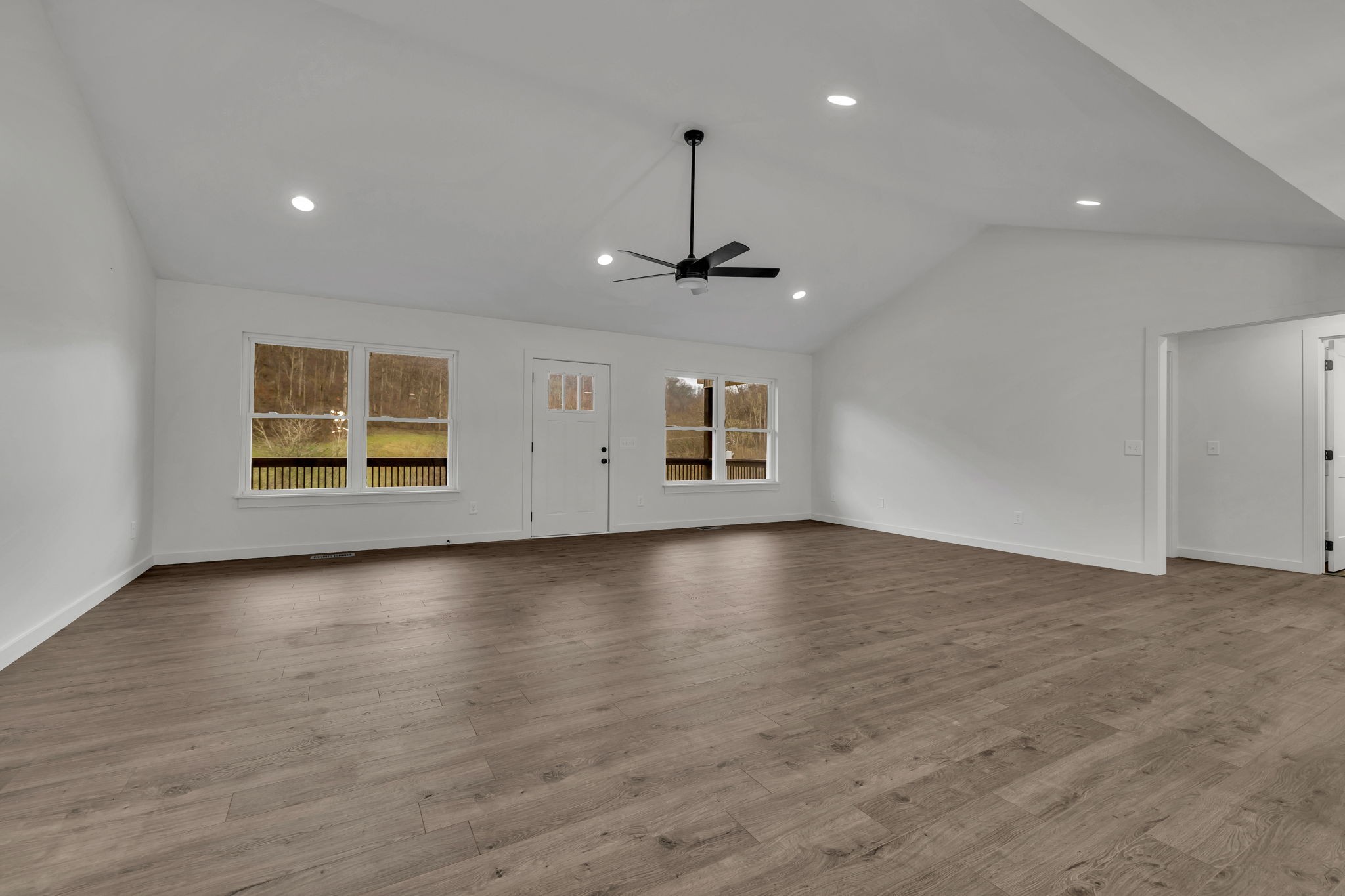 500 Difficult Road Pleasant Shade, TN 37145 - Photo 5 of 40 an empty room with wooden floor and windows
