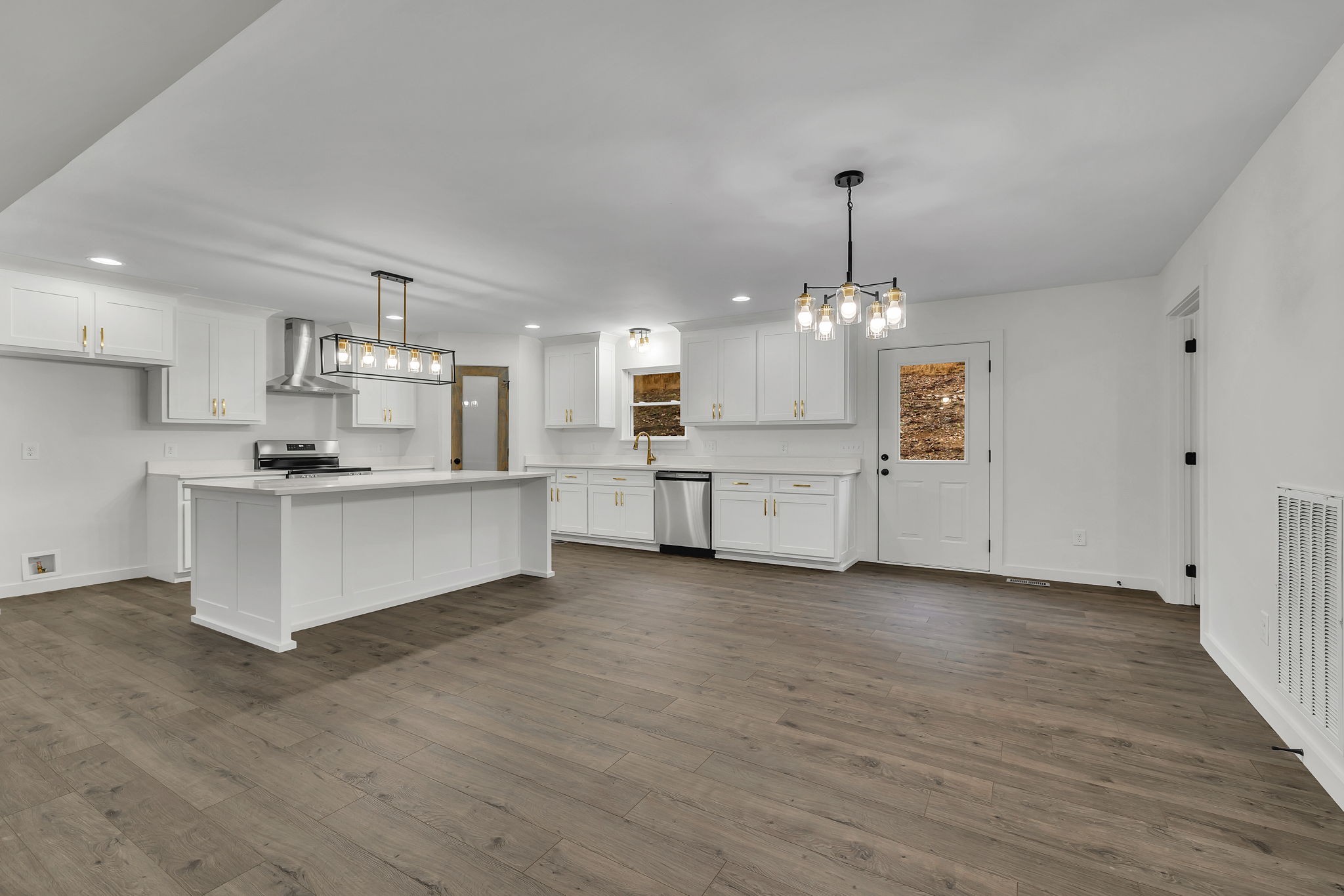 500 Difficult Road Pleasant Shade, TN 37145 - Photo 6 of 40 a view of a kitchen with granite countertop a stove top oven a sink dishwasher and a refrigerator with wooden floor