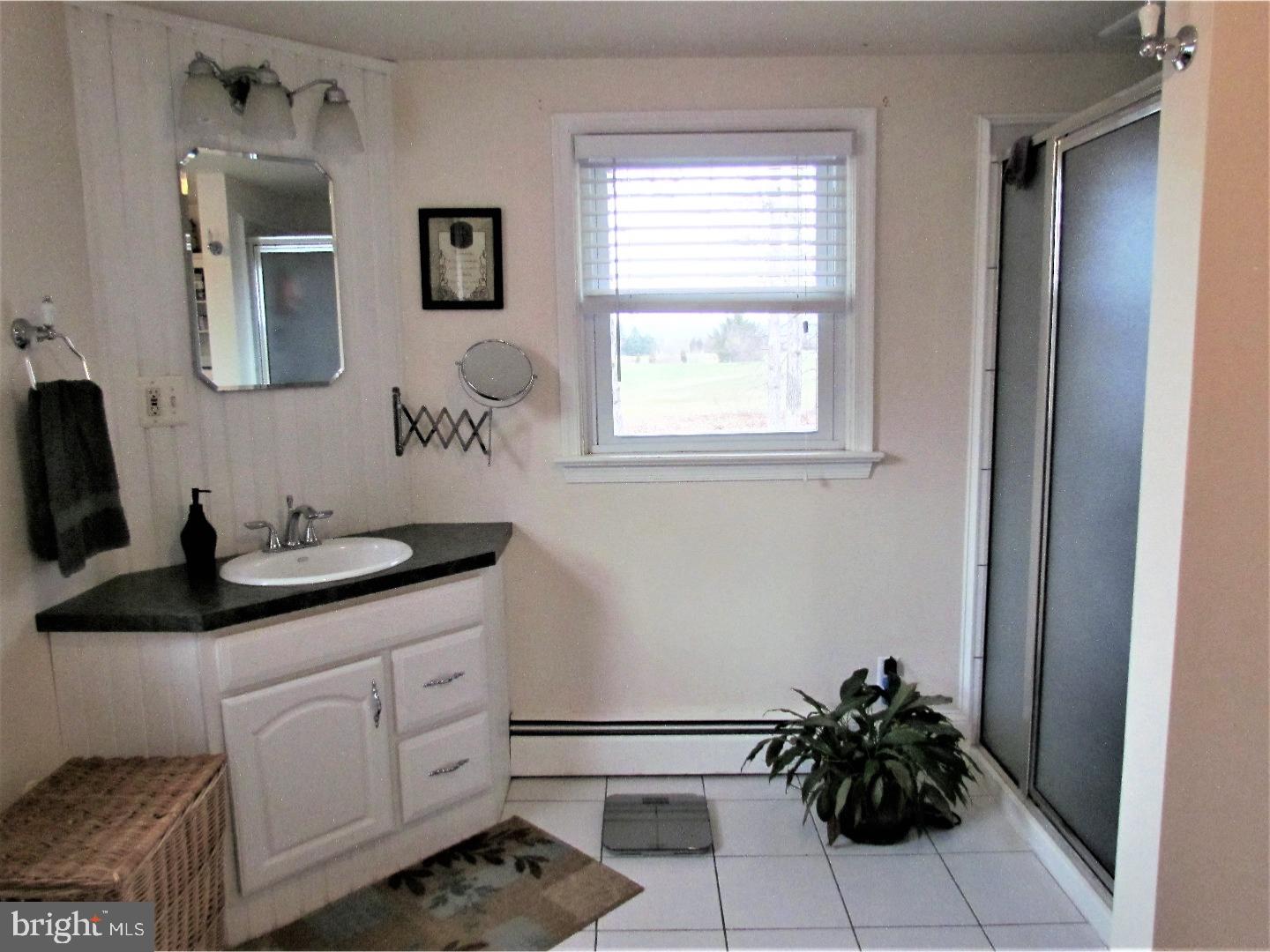 21 Woodside Road Perkasie, PA 18944 - Photo 13 of 25 a kitchen with a sink cabinets and window