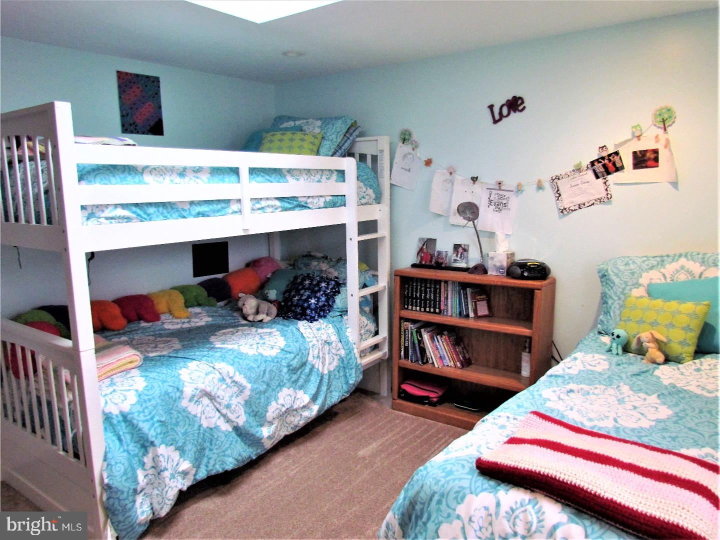 21 Woodside Road Perkasie, PA 18944 - Photo 14 of 25 a bedroom with bed and a wooden floor