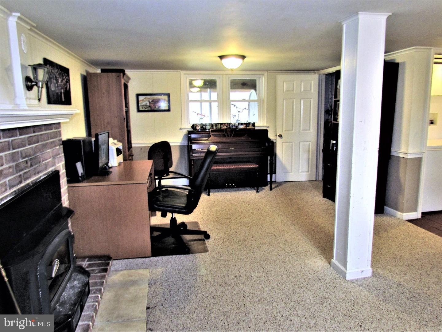21 Woodside Road Perkasie, PA 18944 - Photo 18 of 25 a room with furniture and a fireplace