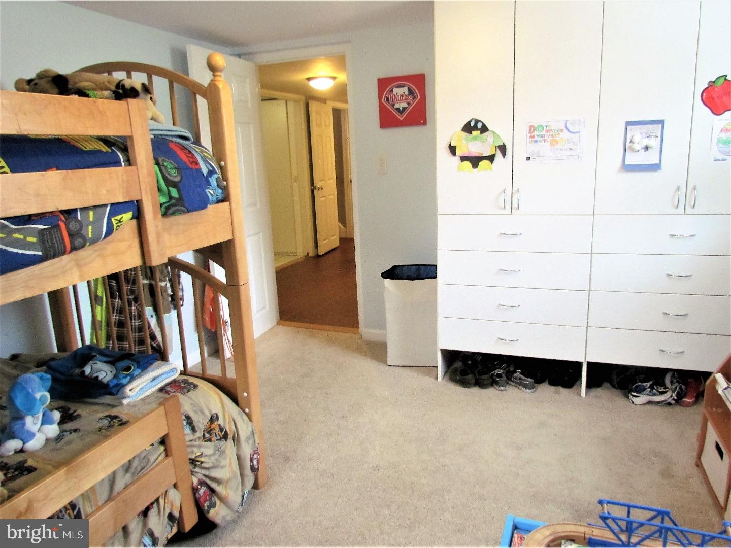 21 Woodside Road Perkasie, PA 18944 - Photo 23 of 25 a view of walk in closet with clothes and shoes