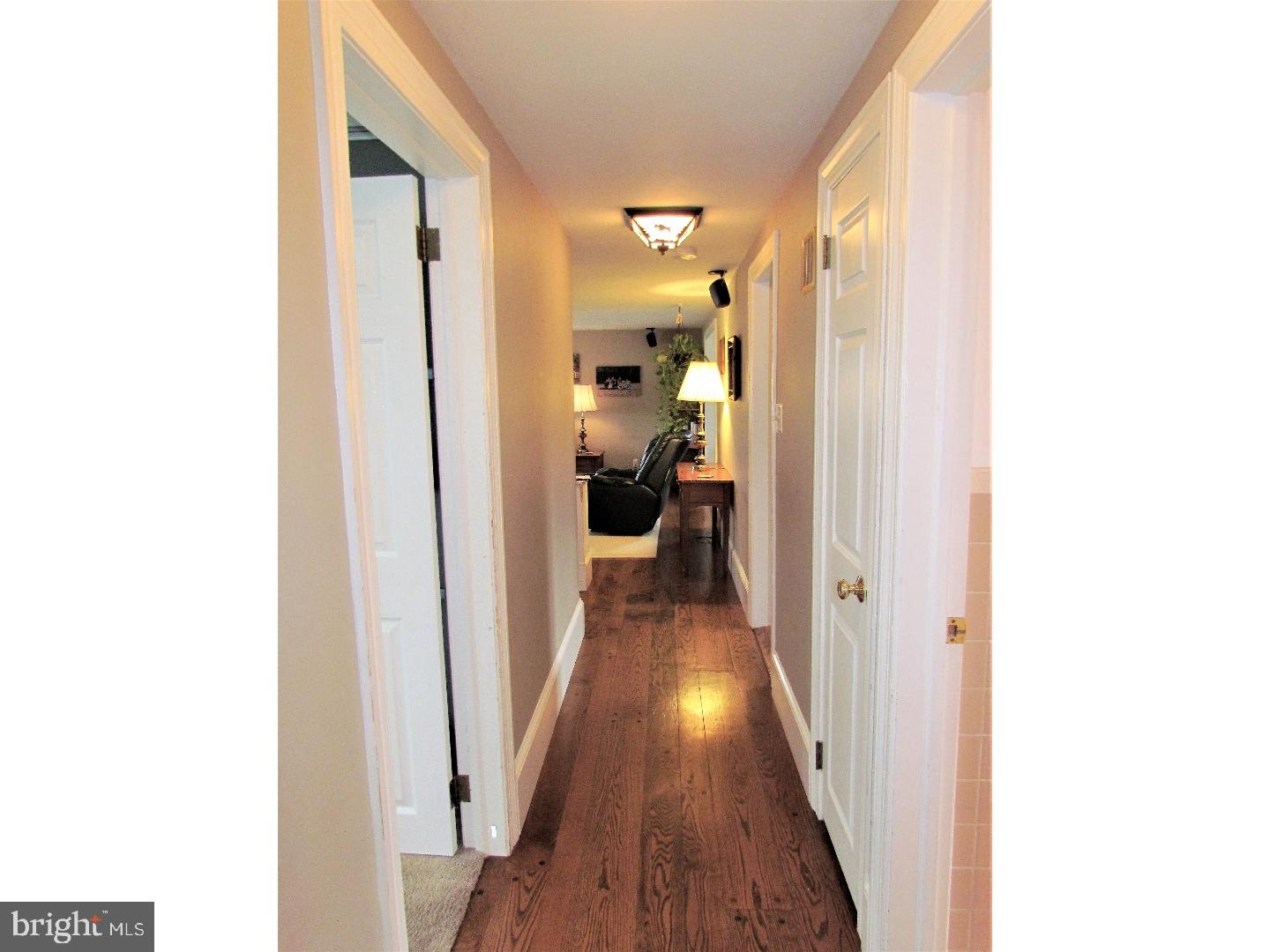 21 Woodside Road Perkasie, PA 18944 - Photo 8 of 25 a view of a hallway with wooden floor