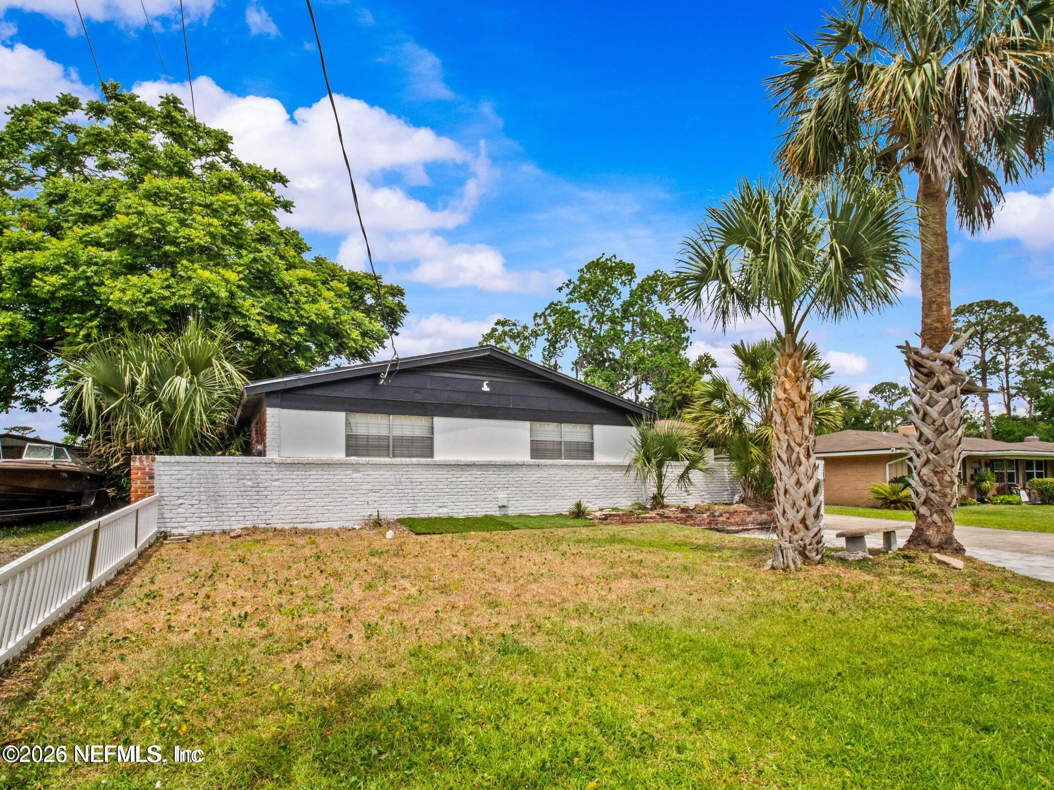 856 Palermo Road Jacksonville, FL 32216 - Photo 3 of 17 a front view of a house with a yard and garage