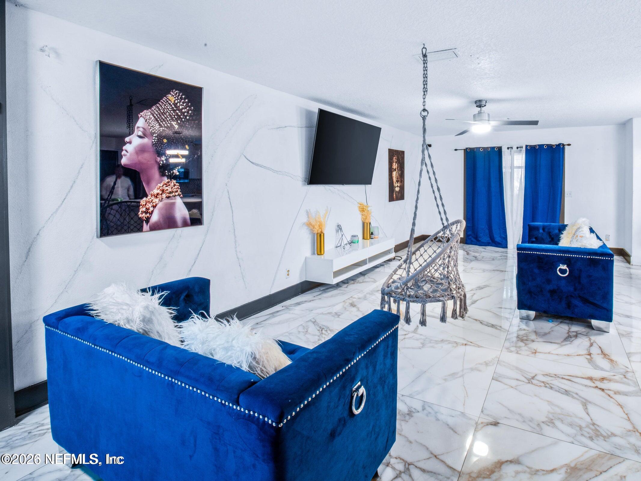 856 Palermo Road Jacksonville, FL 32216 - Photo 4 of 17 a living room with furniture and a flat screen tv