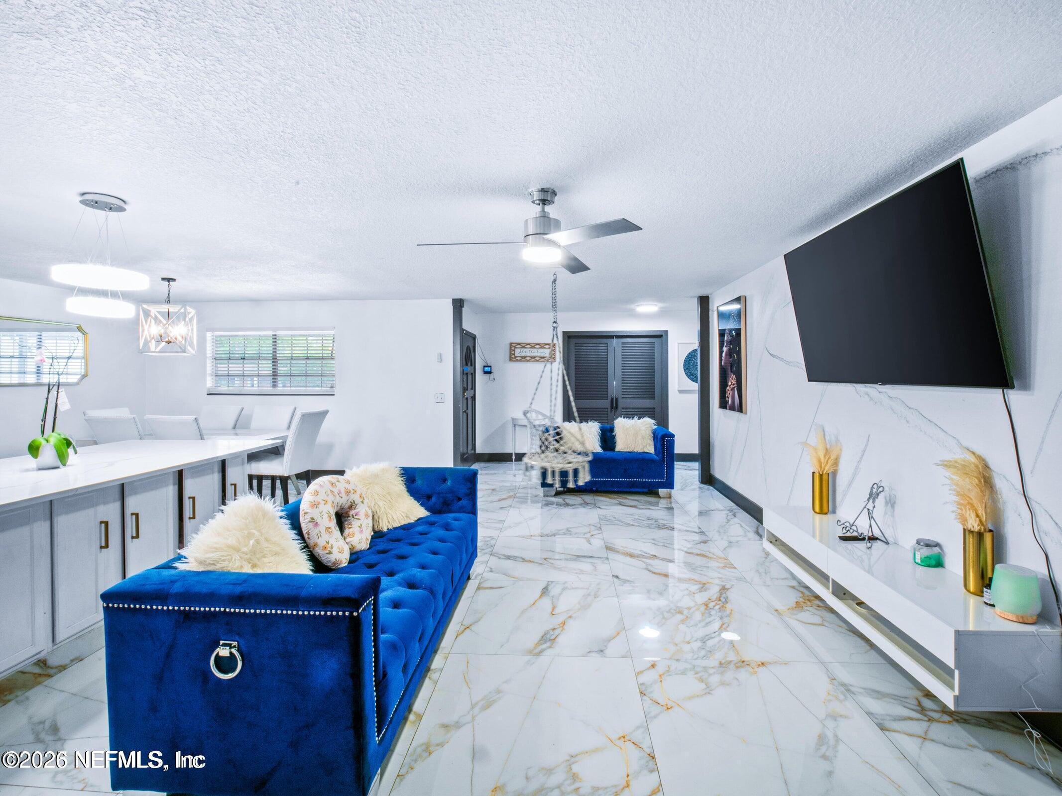 856 Palermo Road Jacksonville, FL 32216 - Photo 8 of 17 a living room with furniture and a flat screen tv