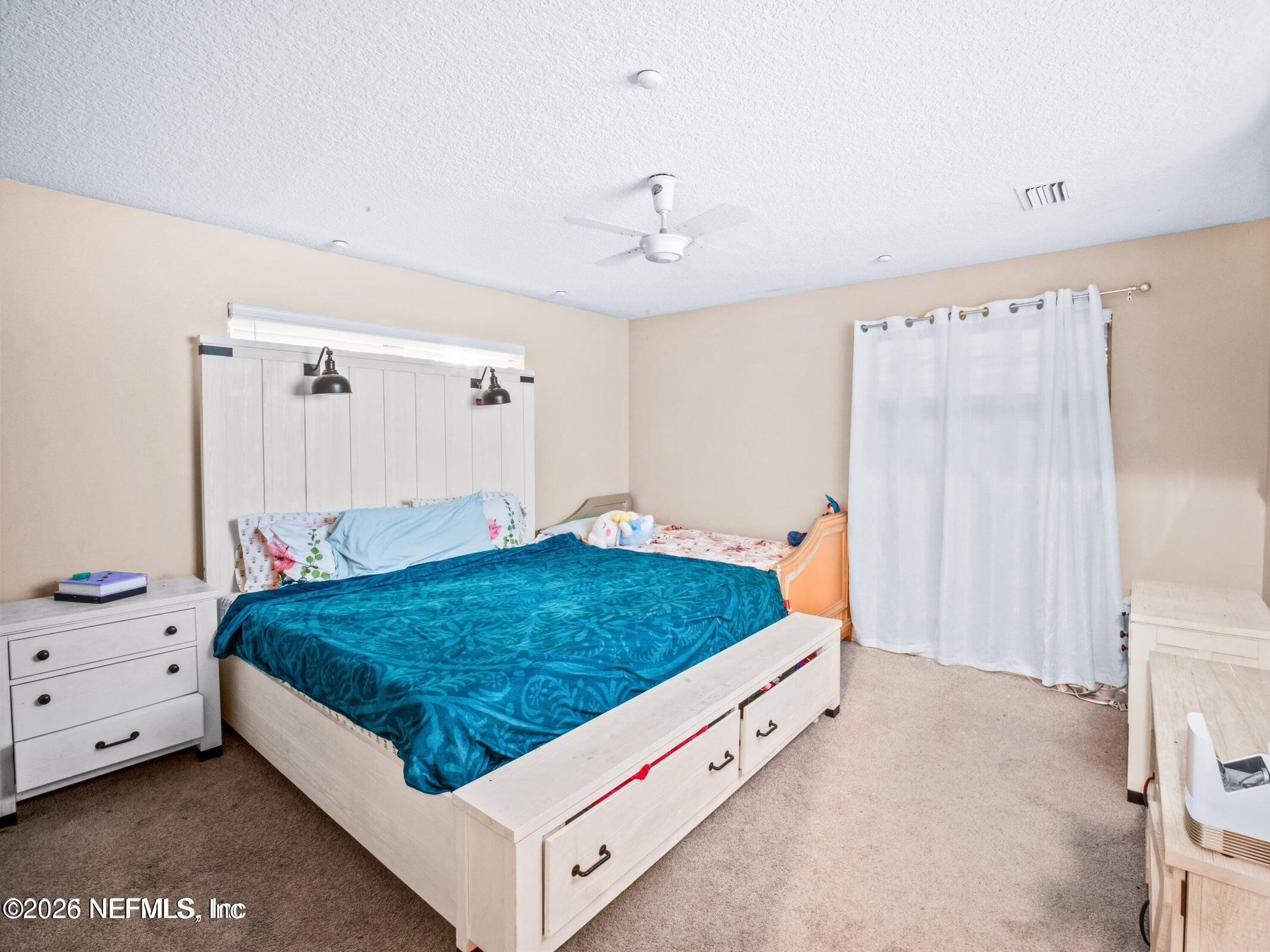 856 Palermo Road Jacksonville, FL 32216 - Photo 9 of 17 a bed room with a bed and a window