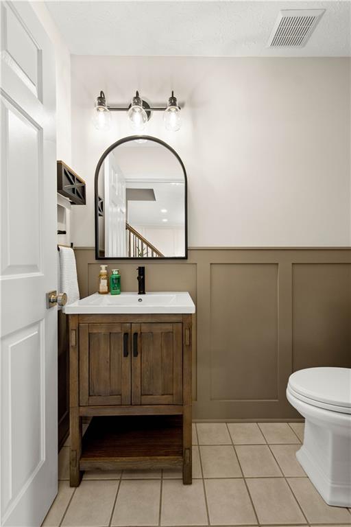 602 Birch Court Bridgeville, PA 15017 - Photo 23 of 47 a bathroom with a sink a toilet and a mirror