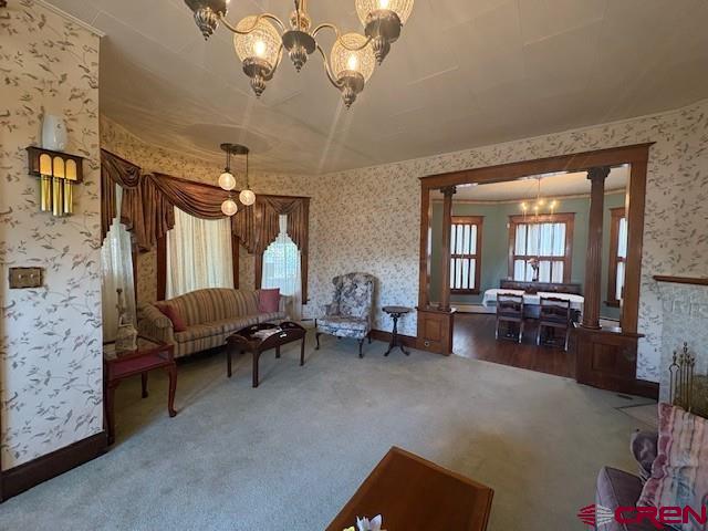 184 Garnet Avenue Delta, CO 81416 - Photo 11 of 36 a living room with furniture and a chandelier