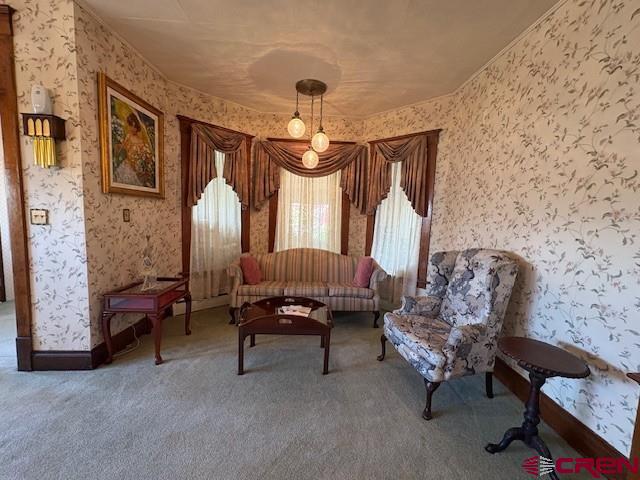 184 Garnet Avenue Delta, CO 81416 - Photo 12 of 36 a living room with furniture and a chandelier