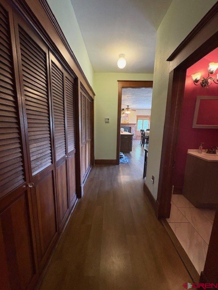 184 Garnet Avenue Delta, CO 81416 - Photo 15 of 36 a view of a hallway with wooden floor and windows