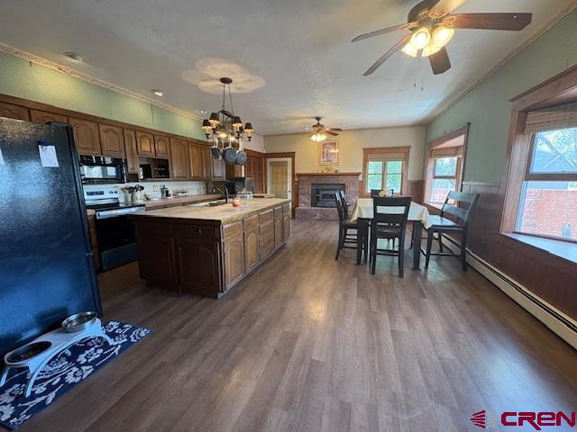 184 Garnet Avenue Delta, CO 81416 - Photo 17 of 36 a kitchen with sink wooden cabinets dining table and chairs